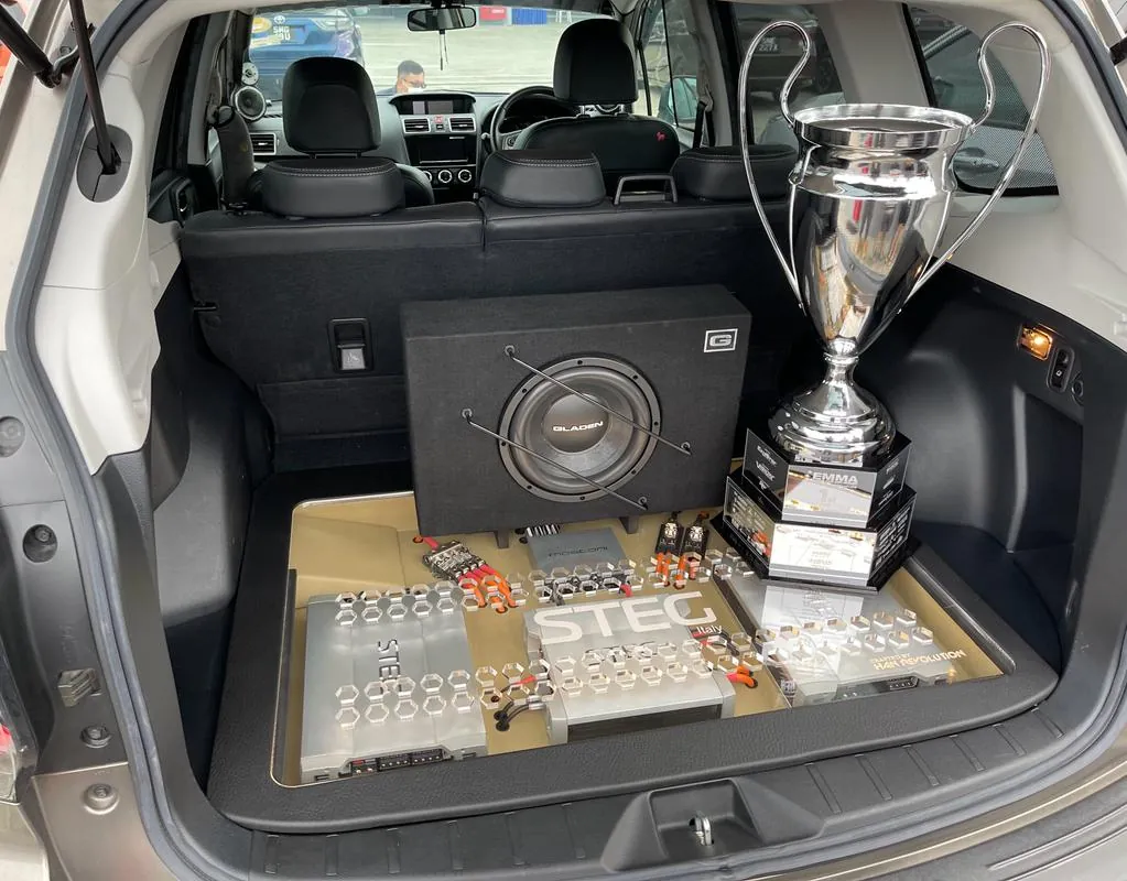 X-Unlimited class winning build with subwoofer enclosure and trophy