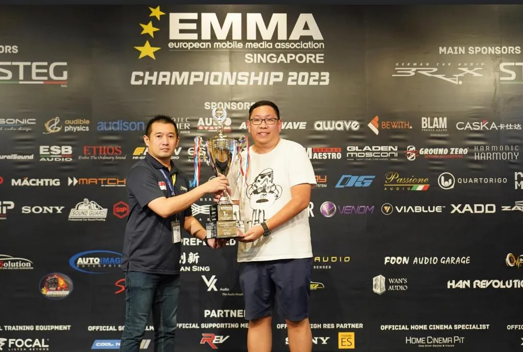 Han Revolution receiving an EMMA Singapore Championship 2023 trophy