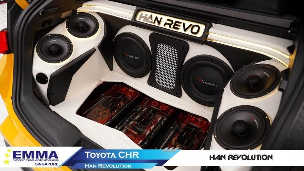 Completed car audio installation by Han Revolution — component speakers and amplifiers mounted in a custom boot panel