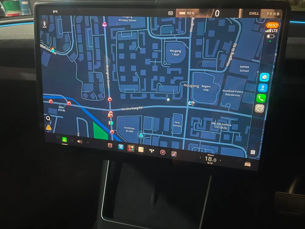 Full-screen Apple CarPlay navigation on a Tesla touchscreen