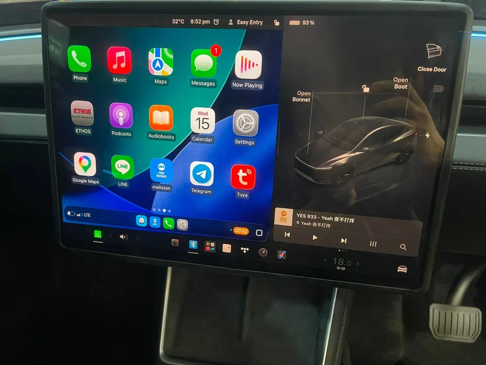 Apple CarPlay app grid running on a Tesla touchscreen