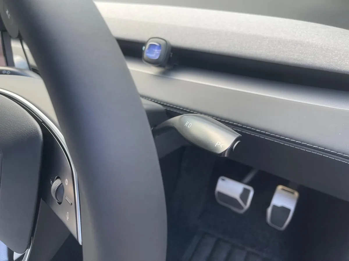 Retrofit gear stalk mounted on the steering column of a Tesla Model Y Juniper