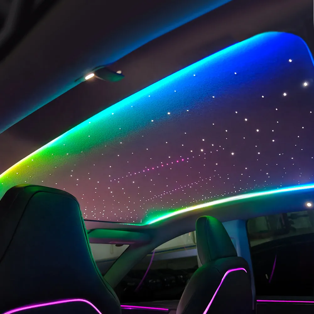 Tesla starlight roof shade lit in a rainbow gradient across the panoramic roof