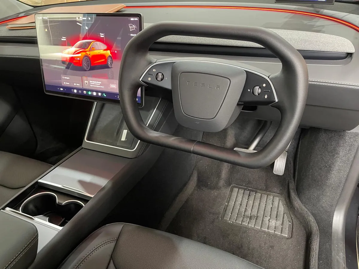 Cybertruck-style yoke steering wheel installed in a right-hand-drive Tesla by Han Revolution