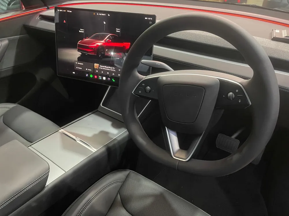 Tesla centre screen angled toward the driver seat after a swivel kit install